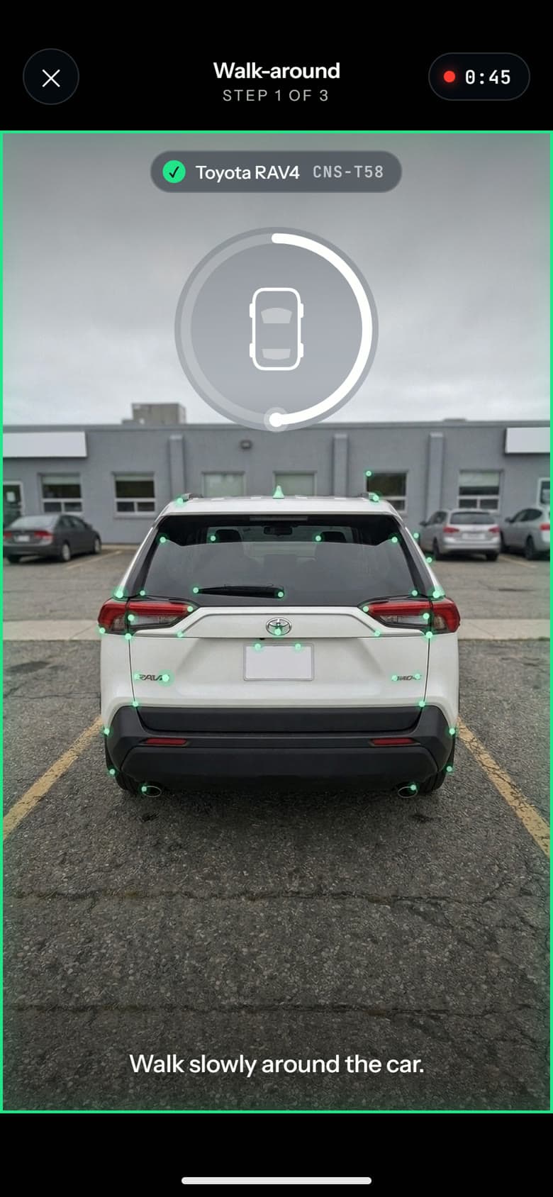 The renter's phone during the guided walk-around: the car tracked, the lap ring filling, the instruction to walk slowly